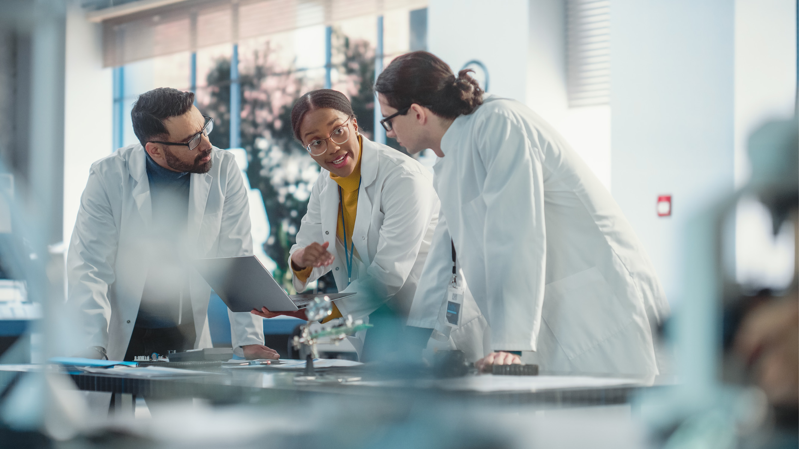 Pharmaceutical experts collaborating in a meeting to review dermal drug delivery device development, analysis, and technical support strategies.